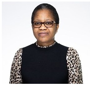 A professional picture of a woman wearing glasses, looking into the distance.